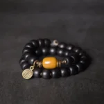 Dzi Bead Ebony Bracelet | Yellow Jade Prosperity Amulet - Buddha Bodhis Dzi Bead Ebony Bracelet Yellow Jade Prosperity Amulet