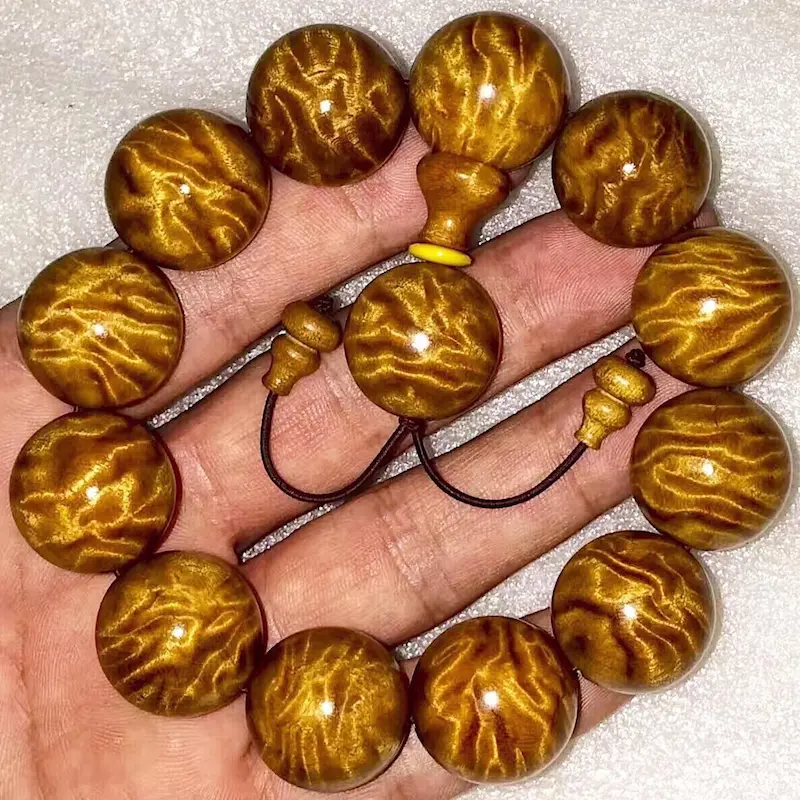 1 - Buddha Bodhis Wearing Golden Phoebe Bracelet on Right Hand