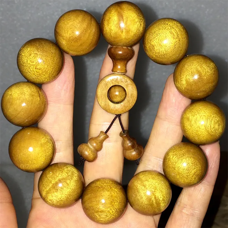 - Buddha Bodhis Golden Silk Phoebe Nanmu Beads Shimmering in Light