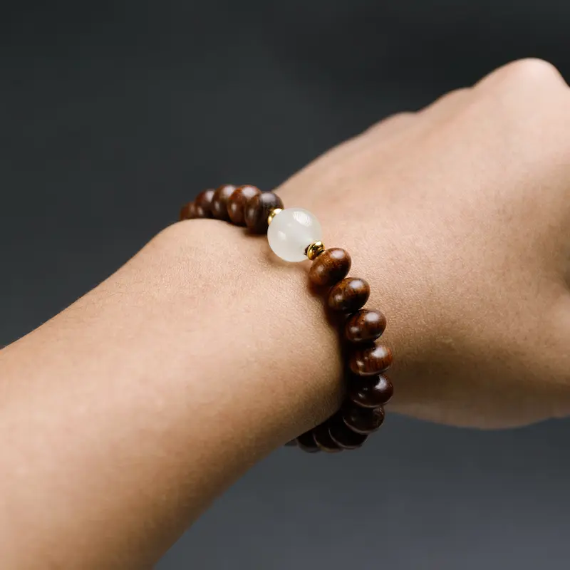 Handcrafted Indonesian Rosewood Cat Ear Comb | Scalp Gua Sha & Meridian Massage Tool 1 - Buddha Bodhis Wearing Rosewood Bracelet on Left Hand