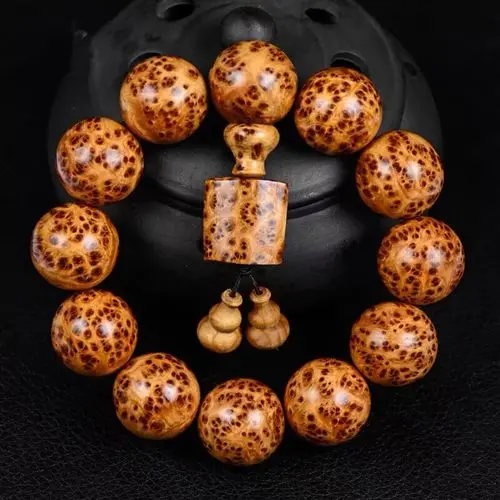 1 - Buddha Bodhis Wearing Thuja Wood Bracelet on Left Hand