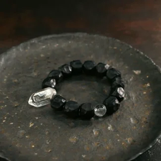The Alchemist's Jewel A Carved Ebony And Quartz Bracelet