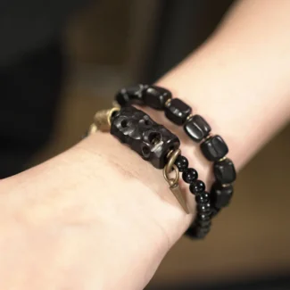 The Guardian's Path A Carved Ebony And Onyx Bracelet