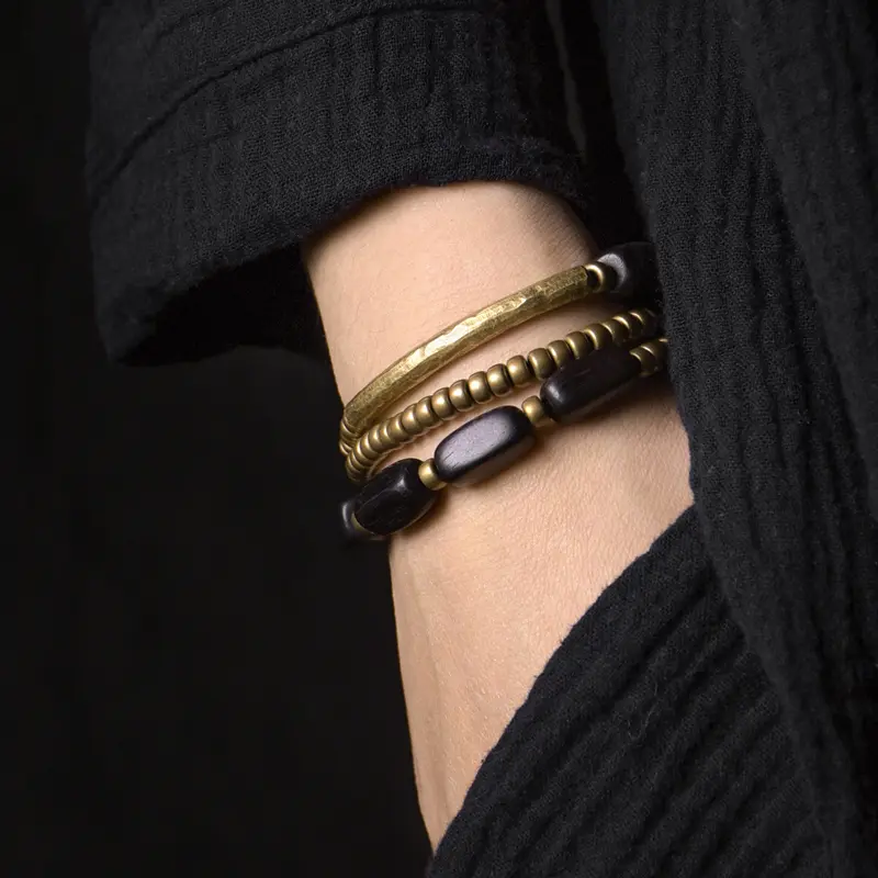 The Path & The Pillar An Ebony and Brass Bracelet Set (1) The Path & The Pillar An Ebony and Brass Bracelet Set