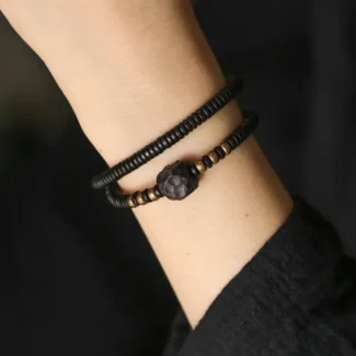 Home 77 - Buddha Bodhis The River Stones A Carved Ebony Brass Wrap Bracelet