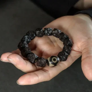 The Wabi Sabi Eye A Carved Ebony Dzi Bracelet
