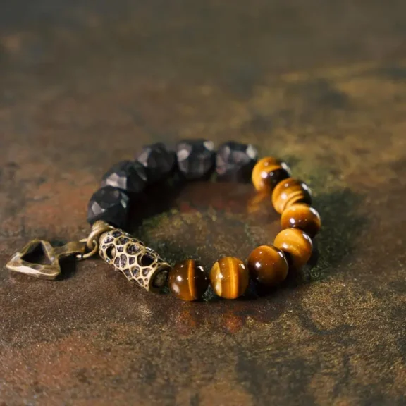 The Meaning of a Tiger Eye Bracelet: Understanding Its Benefits and How to Wear It 1 - Buddha Bodhis Tiger's Eye and Ebony Arrowhead Bracelet Grounded Action