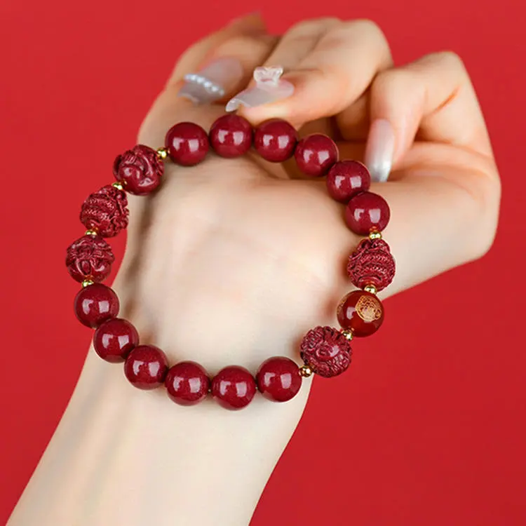 Natural Red Cinnabar Mala Bracelet | Lucky Peanut Charm for Abundance & Growth 1 - Buddha Bodhis Wearing Cinnabar Bracelet on Left Hand