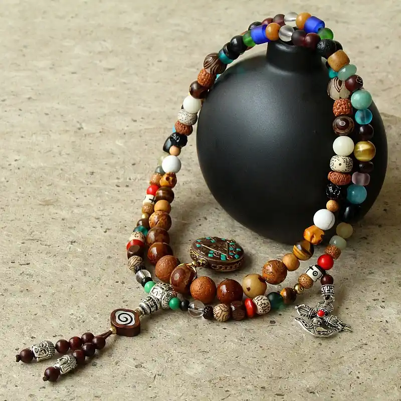 1 - Buddha Bodhis Man wearing layered Tibetan bone necklace and turquoise mala