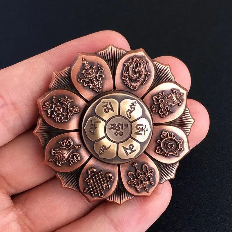 1 - Buddha Bodhis Close up of Om Mani Padme Hum engraving on metal spinner