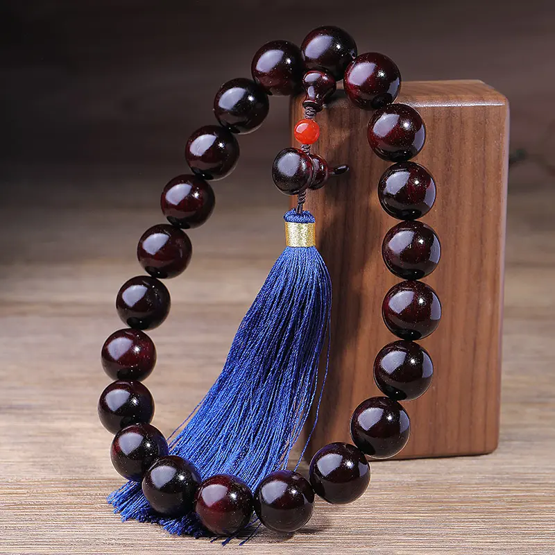 Natural Red Cinnabar Mala Bracelet | Lucky Peanut Charm for Abundance & Growth - Buddha Bodhis Detail of guru bead on sandalwood wrist mala