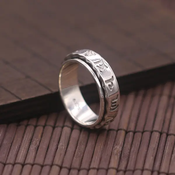 - Buddha Bodhis Hand spinning a silver Om Mani Padme Hum mantra ring
