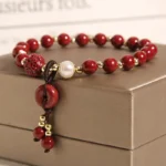 Handcrafted Natural Red Cinnabar Bracelet | Safety Buckle, Pearl & Lucky Clover 3 - Buddha Bodhis Handcrafted Natural Red Cinnabar Bracelet Safety Buckle, Pearl & Lucky Clover