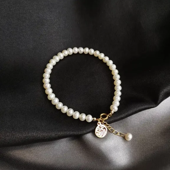 The Deeper Meaning of Pearl Bracelets: Symbolism, Wisdom, and Grace - Buddha Bodhis The Deeper Meaning of Pearl Bracelets Symbolism, Wisdom, and Grace