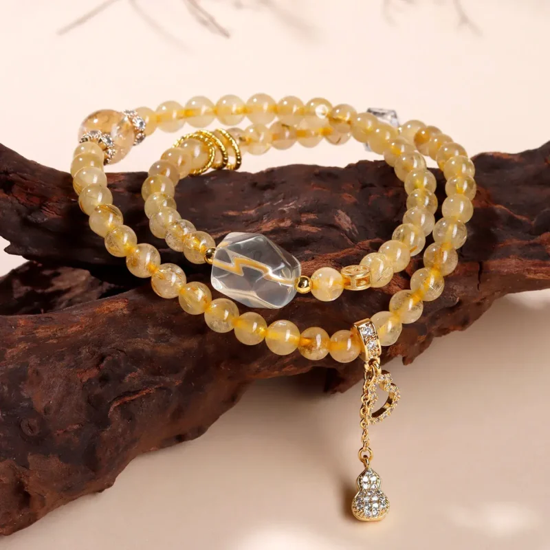 Natural Gold Rutilated Quartz Bracelet – Handcrafted Wealth Hulu Amulet (2) Natural Gold Rutilated Quartz Bracelet - Handcrafted Wealth Hulu Amulet
