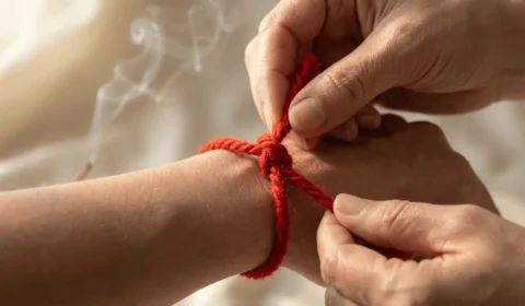 red-string-bracelet-7-knot-left-wrist-ritual
