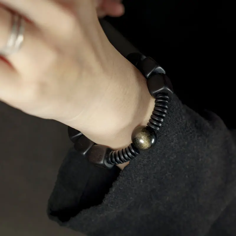 The Dragon's Eye: A Golden Obsidian Ebony Bracelet