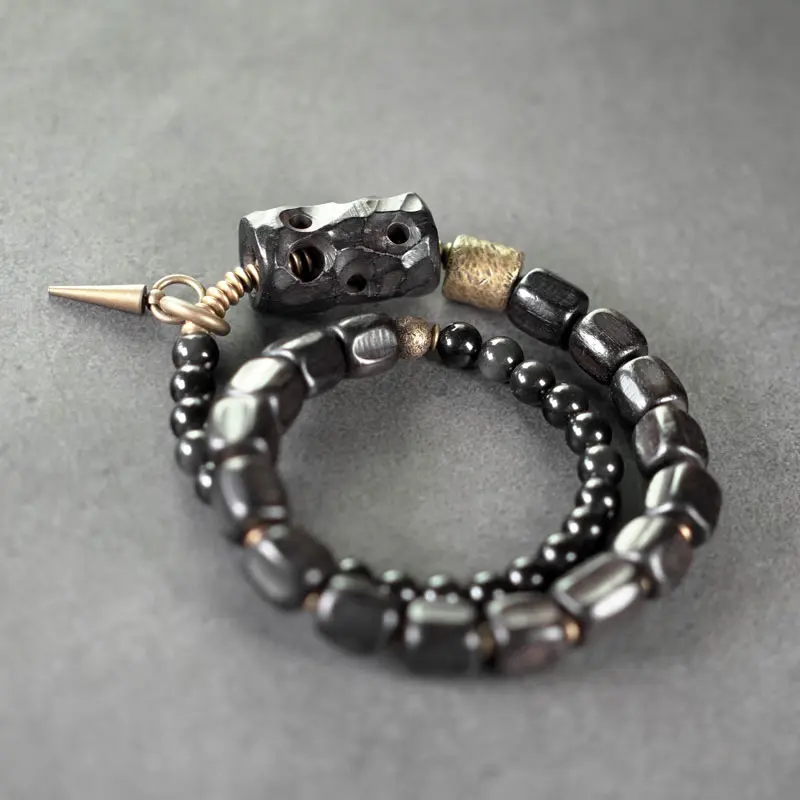 The Guardian's Path A Carved Ebony And Onyx Bracelet