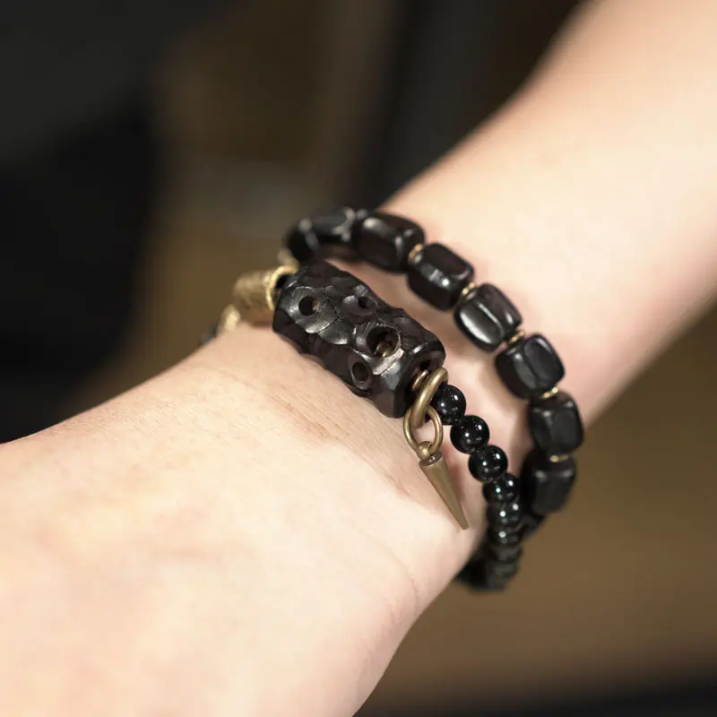 The Guardian's Path A Carved Ebony And Onyx Bracelet