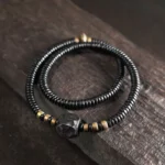 The River Stones A Carved Ebony Brass Wrap Bracelet