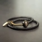 The River Stones A Carved Ebony Brass Wrap Bracelet