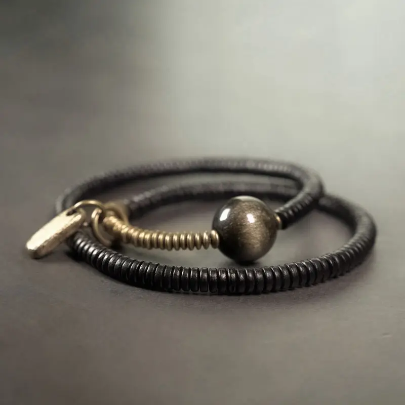 The River Stones A Carved Ebony Brass Wrap Bracelet