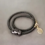 The River Stones A Carved Ebony Brass Wrap Bracelet