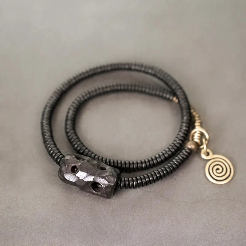 The River Stones A Carved Ebony Brass Wrap Bracelet