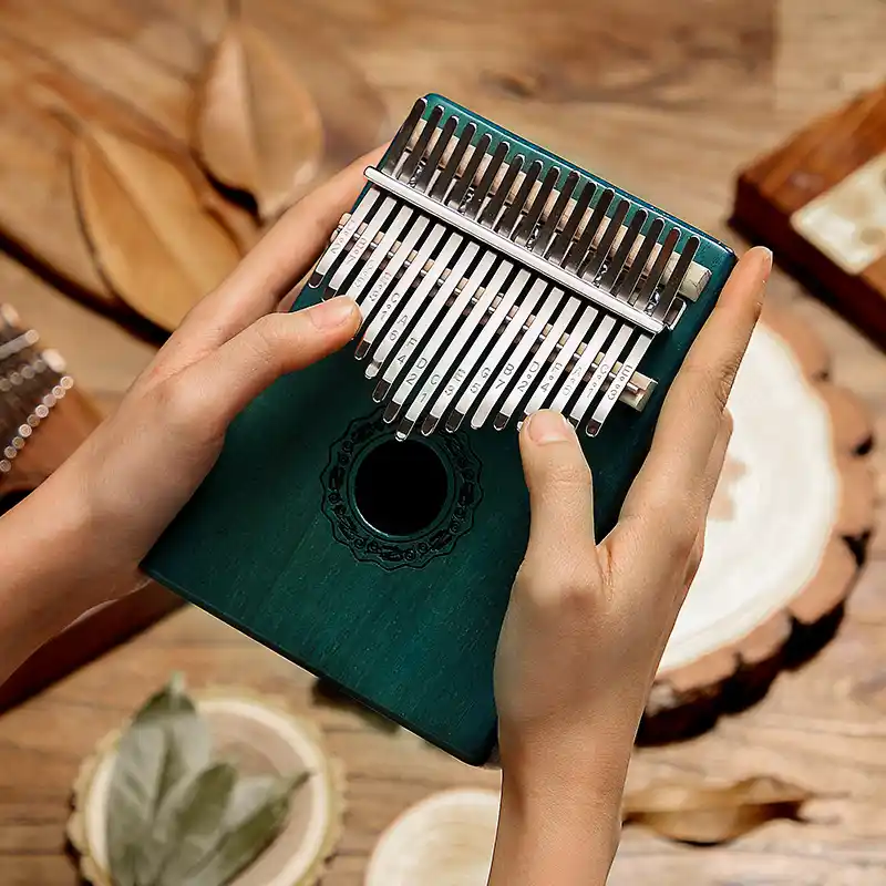 Playing 17 key kalimba thumb piano for relaxation