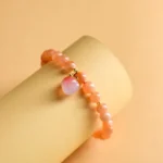 Natural Sunstone Bracelet with Peach Charm - Handcrafted Vitality Jewelry